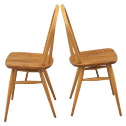 Ercol - set of four 'Windsor' waxed elm chairs, with hoop back design, on tapering supports