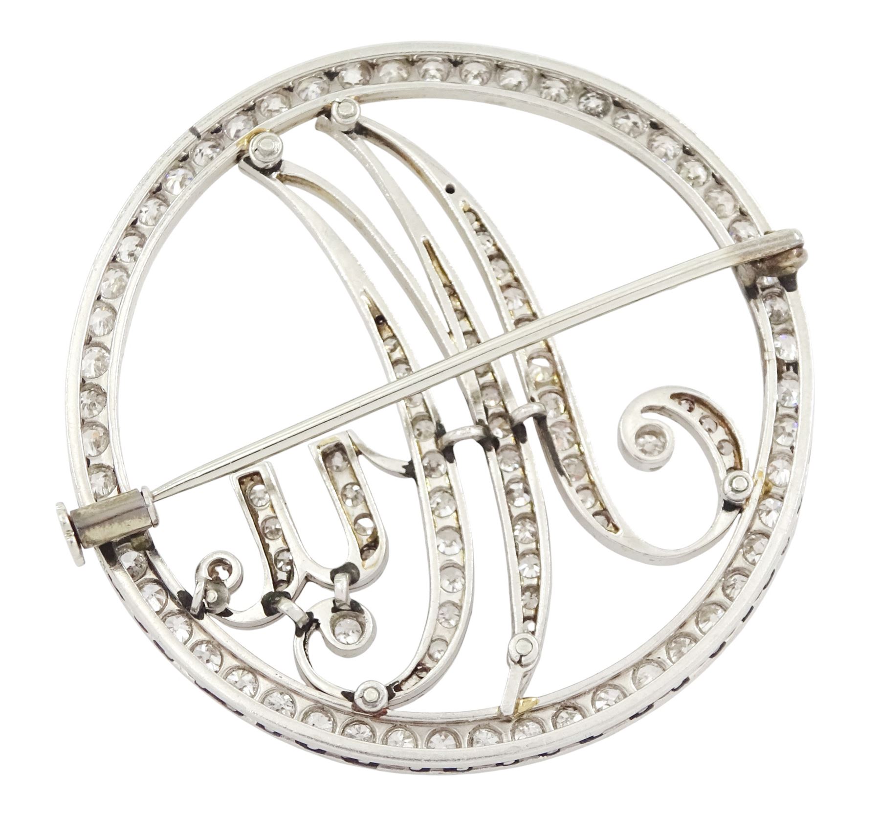 Art Deco platinum and diamond initial brooch, the circular frame and initials 'Mu' milgrain set with old cut diamonds, total diamond weight approx 2.40 carat