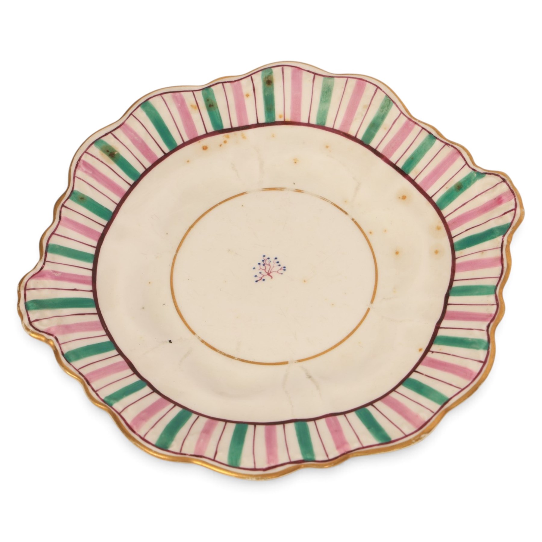 Late 19th century tea service, decorated with a green and pink strips, with internal decoration of budding branch within a gilt band upon a white glazed ground, comprising  twin handle lidded sucrier, milk jug, three serving plates, nine cups and saucers and four teacups