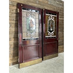 Two early to mid 20th century timber doors, set with lead framed stained glass panels depicting agricultural worker and horse