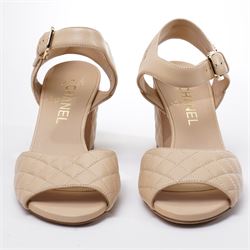 Chanel - pair of beige quilted leather heeled sandals, circa 2016, with stitched diamond pattern uppers, ankle straps with gold tone CC logo detail and hardware, with quilted block heels, size 37C, unused with original dust bags
