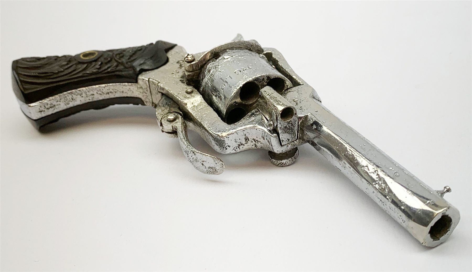 19th century plated Belgian 7mm pin-fire revolver, the six-shot cylinder inscribed 'The Young Lion 1881 New Pattern', with folding trigger and carved walnut split stock, barrel length 7.5cm, overall length 18.5cm