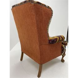 Late 20th century beech framed wingback armchair, sprung seat and back upholstered in kilim cover, acanthus carved cabriole supports with ball and claw feet