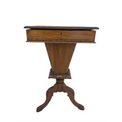 Victorian walnut work table, the rectangular hinged top inlaid with a chessboard design, canted edge with alternating ebony and satinwood inlays, concealing fitted interior, banded and strung frieze over tapering column well, collar carved with foliate decoration, on a cabriole tripod base