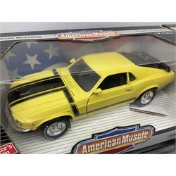 Four Ertl American Muscle 1:18 scale die-cast models - 1969 Pontiac GTO; 1970 Ford Boss 302 Mustang; 1957 Chevy bel Air; and 1967 Corvette L-71