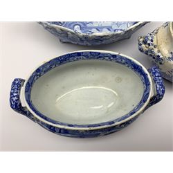 Early 19th century Spode blue and white twin handled basket, with osier moulded sides and pierced rim, decorated in the Castle pattern, L26.5cm, together with two early 19th century Spode blue and white soup tureens (lacking covers), the first example decorated in the Entrance to the Ancient Granary pattern from the Caramanian series, L18.5cm, the second example decorated in the Italian pattern, L18cm, each with impressed and/or printed marks beneath, (3)