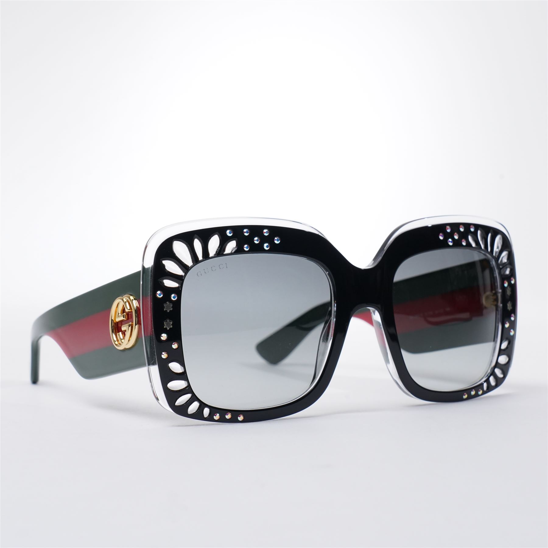Gucci - pair of oversized black acetate sunglasses, the square frames with studded and crystal embellishment to the front and signature green and red web temples with interlocking gold-tone GG logo and bee motif, unused with original velvet pouch and box