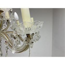 Victorian style glass eight branch chandelier, with drip trays, brass tone support, and drops