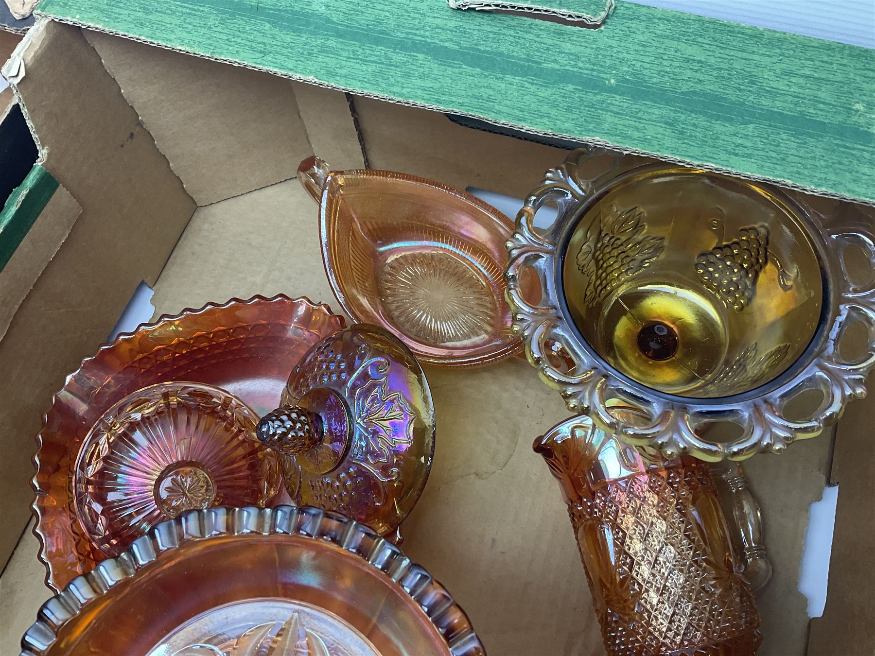 Collection of orange carnival glass, including jugs, dishes, vases etc, in two boxes 