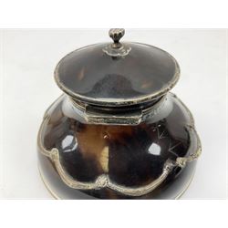 Edwardian silver and tortoiseshell inkwell by William Comyns & Sons, the domed hinged cover with bud finial opening to reveal the interior with clear glass liner, the domed body mounted with swags and raised upon four squashed bun feet, hallmarked William Comyns & Sons London 1906, H9cm