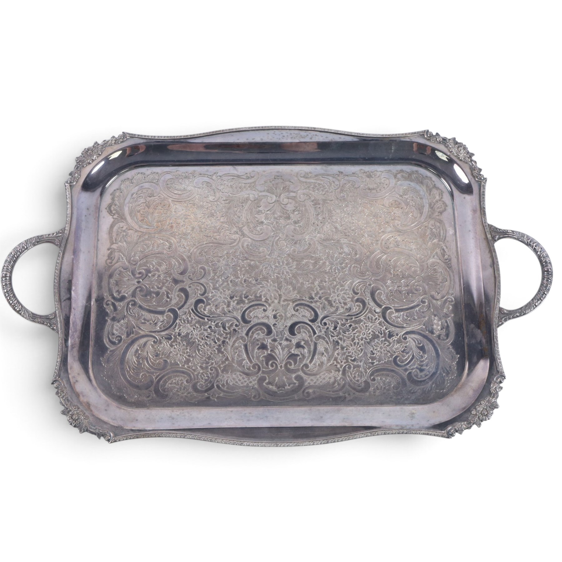 Early 20th century silver plated four piece melon-shaped tea service by James Dixon & Son Sheffield, comprising teapot, hot water jug, milk jug and open sucrier, together with a silver plated twin handled tray with engraved floral decoration
