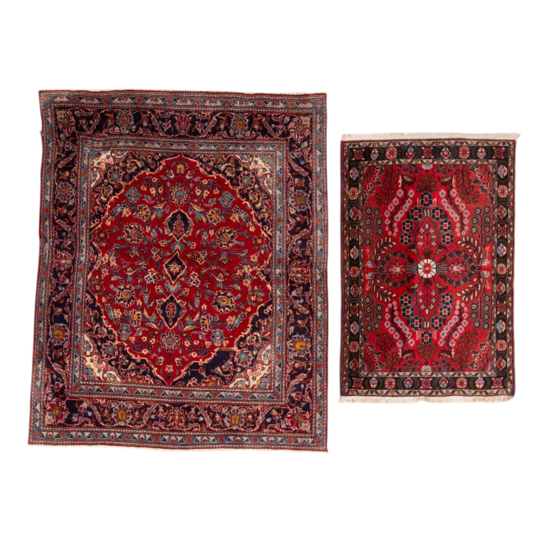 Two Persian rugs, the larger with a crimson field decorated with three linked indigo medallions amongst flowering tendrils, shaped floral spandrels and an indigo palmette border, (161cm x 129cm), the smaller with a crimson field centred by an ivory rosette amongst stylised flowering plants, within a dark floral border, (114cm x 79cm) (2)