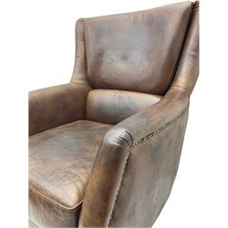 Library chair, upholstered in tan leather, studded detail, light wood square feet
