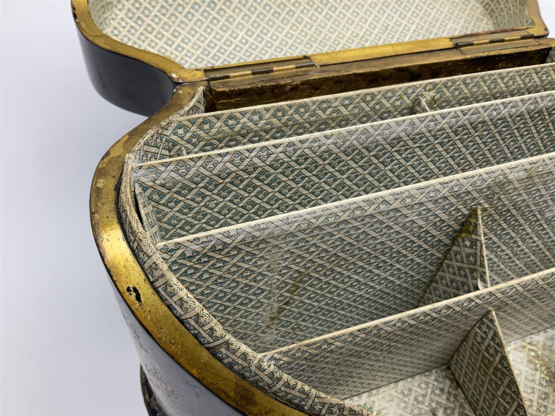 Victorian papier-mâché stationary box, of rounded wedge form with mother of pearl escutcheon, the hinged and curved cover and sides hand painted with floral sprays, opening to reveal a lined and fitted interior, H15cm L22cm D16cm