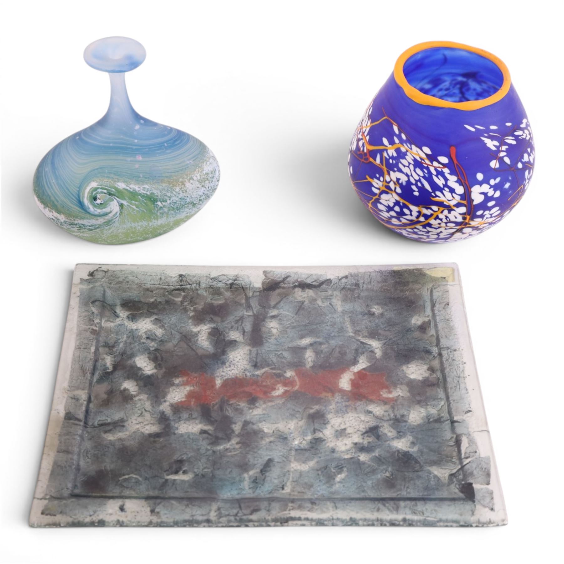 Art glass vases, of squat form with elongated neck, decorated with waves, together with another vase and a glass tray, largest H17cm
