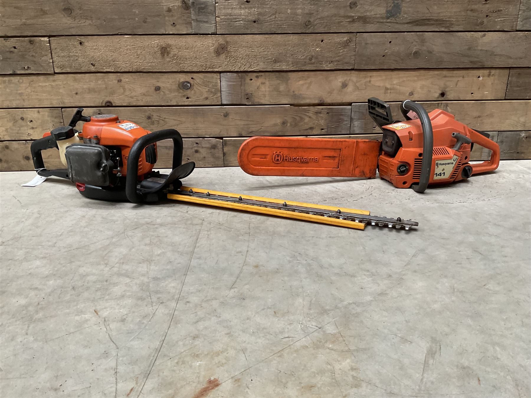 Husqvarna 141 petrol chainsaw and a Husqvarna 226HD75S petrol hedge cutter