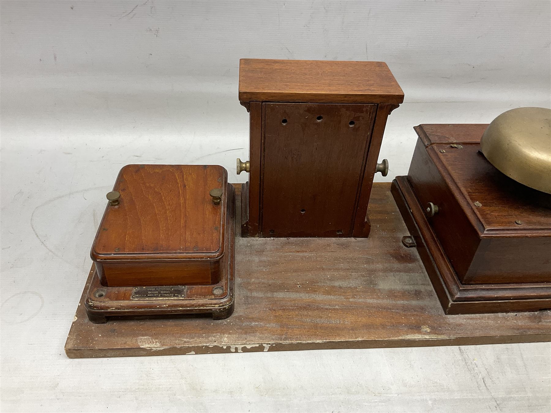 Railway signal boxes, mounted on plinth, with railway block indicators for Up Line and Down Line, having an electromagnetic indicator showing 'Train on Line' 'Line Clear' and 'Line Blocked', and brass signal bell to the centre, L100cm