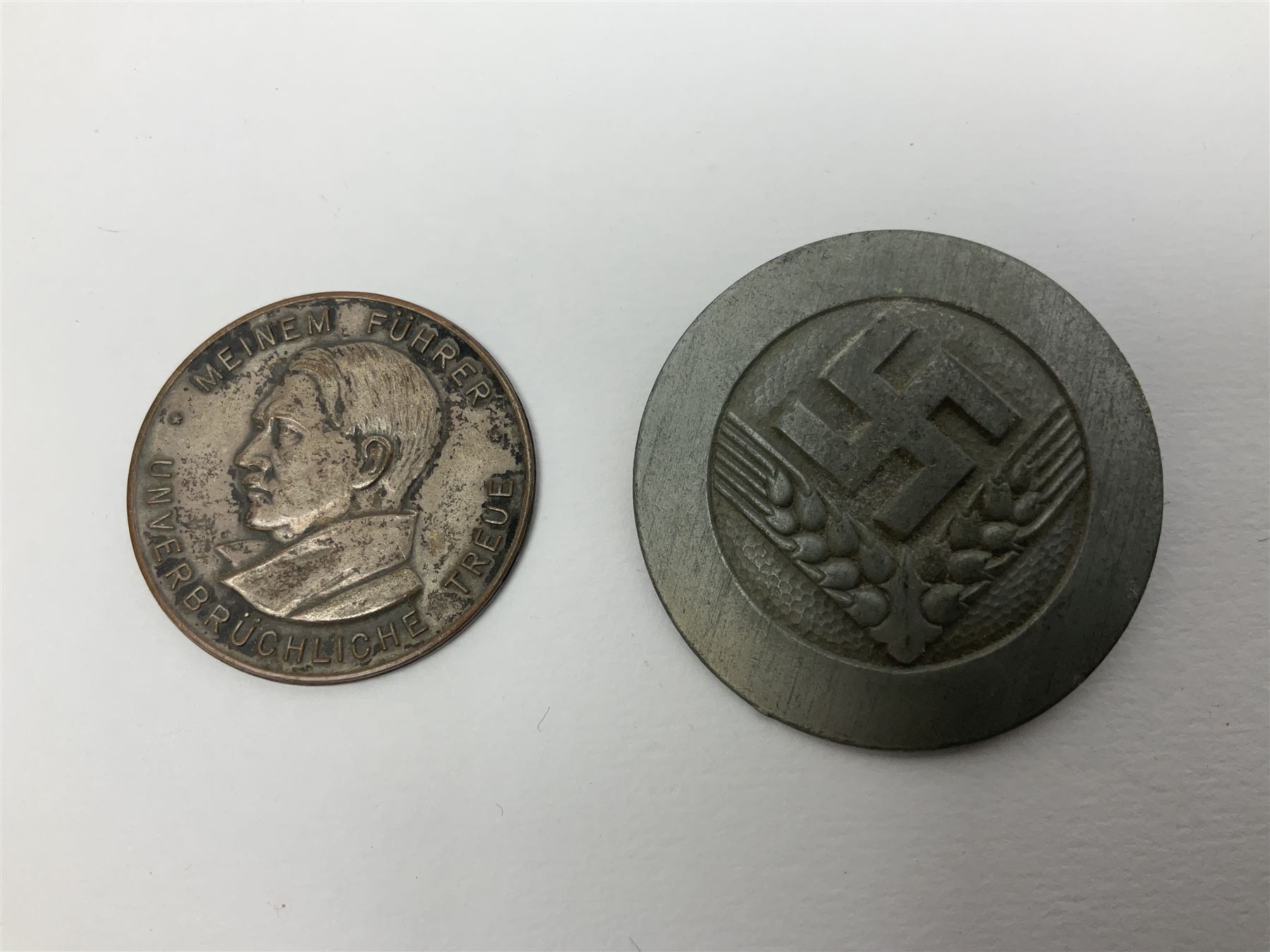 Five WW2 German medals/badges -German Defences West Wall Medal, War merit Cross, Red Cross Decoration, RAD tinnie brooch and Adolf Hitler 1934 medallion (5)