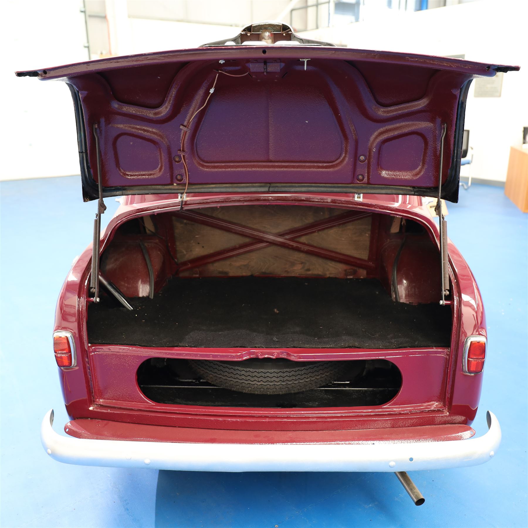 1953 Hillman Minx Saloon

Registration: NYP 135
Engine: 1,265cc petrol
Transmission: Manual, column change
Odometer reading: 37,553 miles
Colour: Maroon red
Interior: Cream
Former keepers: 3
V5C: Present
Keys: One

A 1953 Hillman Minx four-door saloon, finished in maroon red with a contrasting cream interior.

Powered by a 1,265cc petrol engine with manual column-change transmission. The Smiths speedometer displays 37,553 miles, although this mileage has not been independently verified.

The vehicle has previously been restored and presents with glossy maroon paintwork, cream bench seating and a period dashboard and steering wheel. The engine bay is painted to match the exterior and appears generally tidy. The underside has been coated or undersealed in places, with the chassis, floor sections, suspension and exhaust visible in the accompanying photographs.

At the time of cataloguing, the engine turned over but did not start.

Features

• 1,265cc petrol engine
• Manual column-change transmission
• Right-hand drive
• Four-door saloon body
• Maroon red exterior
• Cream bench-seat interior
• Smiths instrumentation
• Period dashboard controls
• Steel wheels with chrome hubcaps
• Chrome bumpers and exterior trim
• Rear-hinged bonnet
• Leaf-spring suspension

History and Documentation

• V5C registration document present
• Three former keepers recorded
• One key
• Pitman’s handbook included

Condition

The vehicle is presented in restored condition. The maroon paintwork retains a good overall gloss, with some age-related marks and imperfections visible on closer inspection.

The cream interior presents well overall, with signs of age and use to the upholstery, carpets, dashboard and controls. Some surface deterioration and pitting are visible to areas of the chrome and brightwork.

The engine bay appears tidy, although some wiring and ancillary components appear non-original or subsequently renewed. The underside has received protective coating or underseal in areas. Prospective purchasers should inspect the structure, chassis, floor, suspension and mechanical components carefully.

At the time of cataloguing, the engine turned over but did not start. The vehicle has not been mechanically inspected or road tested by the auctioneers.

Prospective purchasers should satisfy themselves as to the vehicle’s condition, specification, originality, mileage, identity and roadworthiness before bidding.

This vehicle forms part of the Estate of the Late John Sills and is offered for sale by the Executors, confirming a genuine reason for sale.