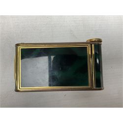 Art Deco camera shaped lady's musical compact and cigarette case, probably German, with green marble effect panels and gilt highlights, with large hinged opening to reveal engine turned brass interior with cigarette or lipstick holders, and the other side with musical mechanism and flip action powder compartment with mirror, L10cm