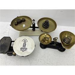 Three sets of brass and cast iron kitchen balance scales and various weights