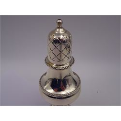 Modern silver two piece cruet set, comprising salt shaker and pepper shaker, both of waisted form with engraved rope twist borders, the removable pierced covers each with engraved lattice decoration, upon a circular spreading foot, hallmarked Laurence R Watson & Co, Birmingham 1989, H14.5cm, contained within velvet lined fitted case