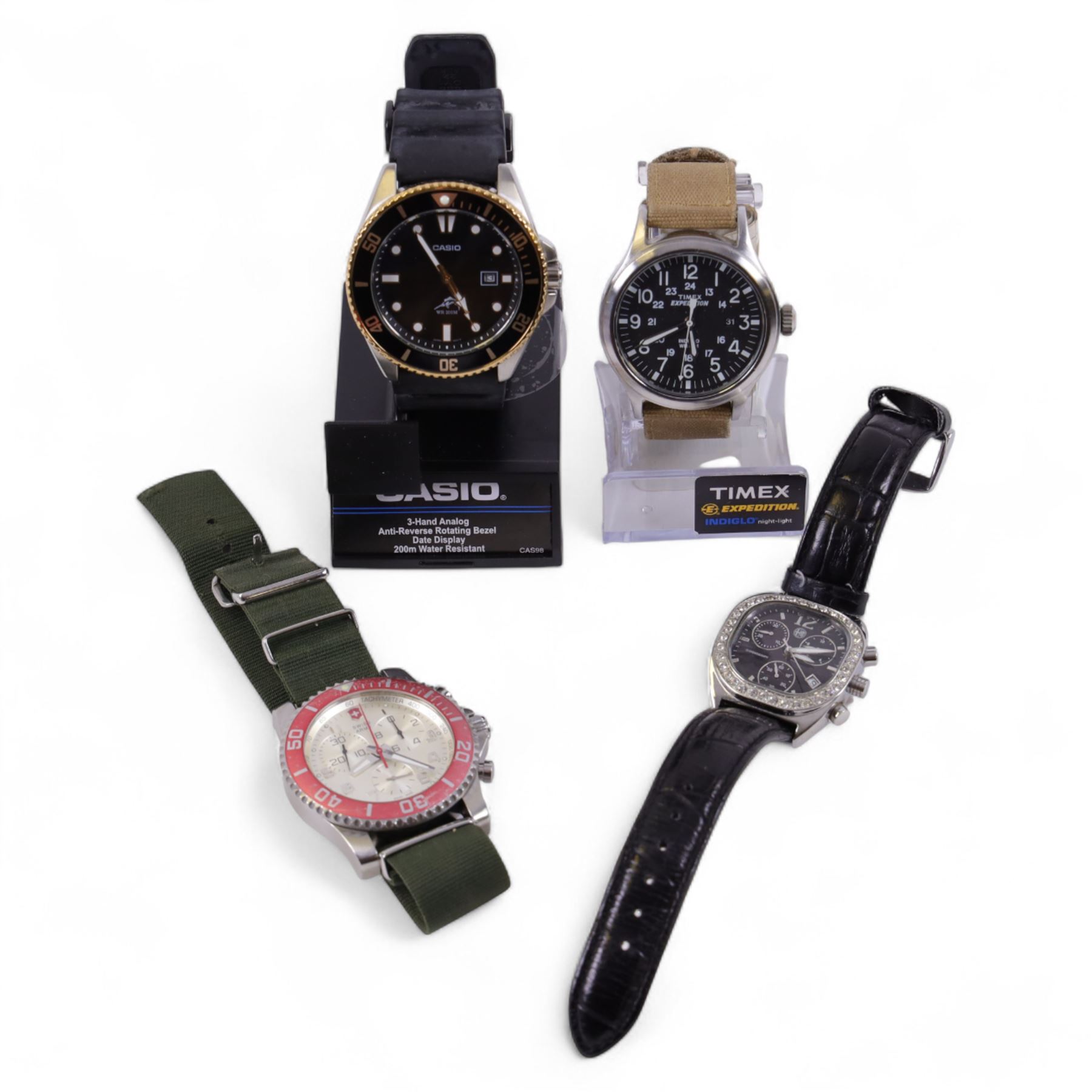 Four quartz wristwatches including Swiss Army chronograph, Timex Expedition, Casio and Alfa Romeo