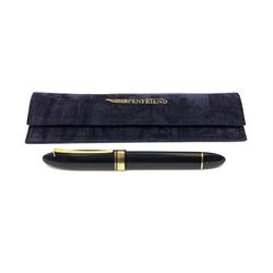 An Omas 360 fountain pen, the black triangular section body with gold coloured clip and banding, and Greek Key border to the cap, the bicolour nib marked 750 18K.