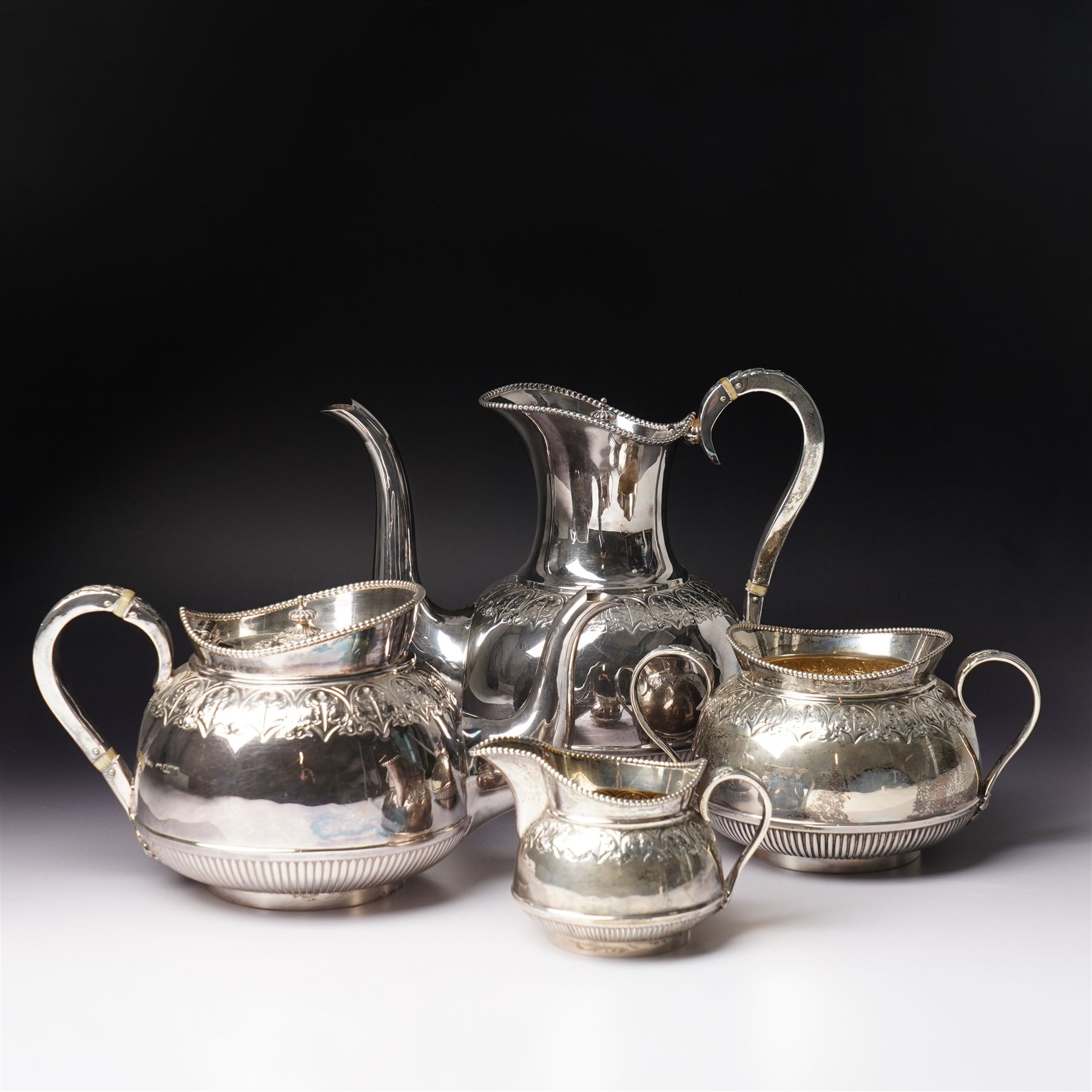 Edwardian silver four piece tea and coffee set with leaf capped handles and foliate banding Sheffield 1902-1905 Maker Richard Richardson