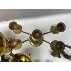 Four brass pestle and mortars, to include two miniature examples, together with other brassware including four branch candleabra, bells etc
