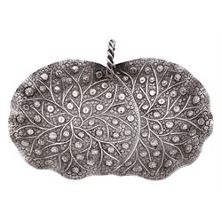 Middle Eastern silver bon bon dish, of oval form, with lobed rim and twisted loop handle, with repousse and chased floral and foliate decoration throughout, upon three bun feet
