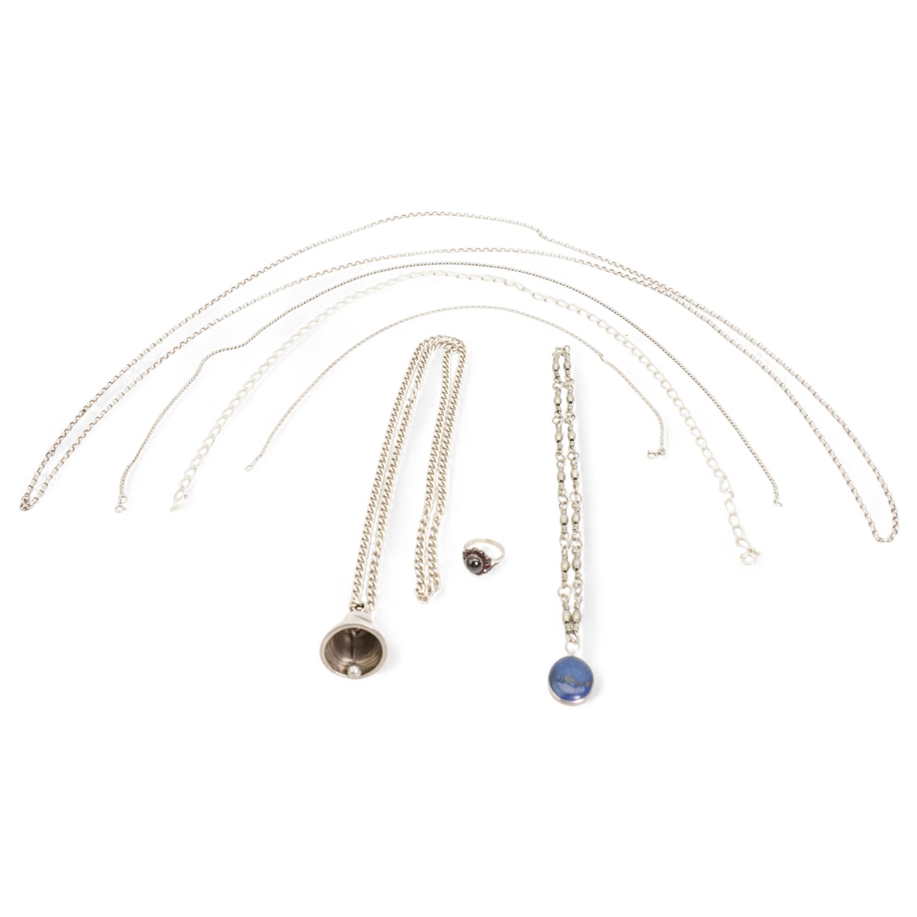 Early 20th century silver bell pendant, Birmingham 1915, on later silver chain, silver chain necklaces, silver garnet ring and a silver lapis lazuli pendant on white metal chain