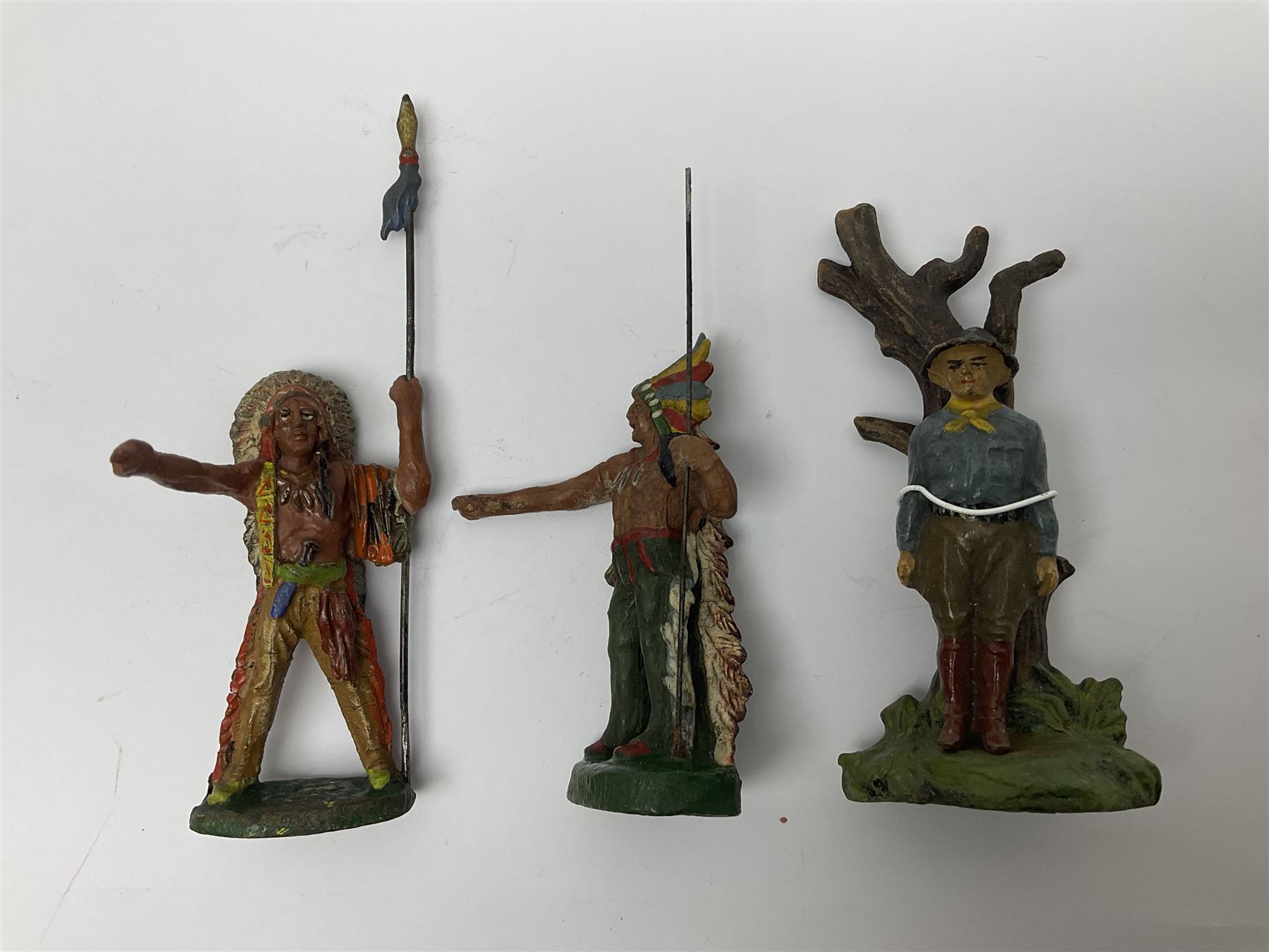 Five Elastolin American Indian figures, together with an Elastolin campfire and a cowboy tied to a tree, tallest H11cm