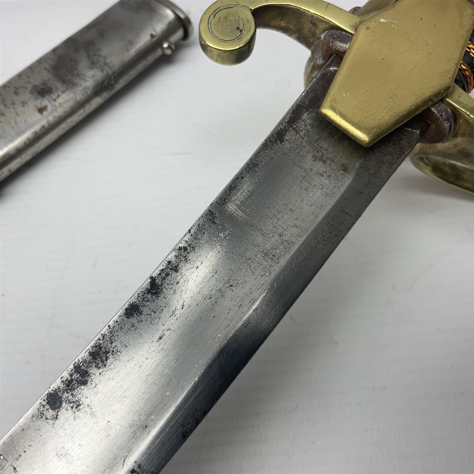 19th century Russian Imperial Navy sword, with 77.5cm curving fullered blade, brass three-bar hilt with lozenge shaped langets and wire-bound leather grip; in polished steel scabbard with one suspension ring L97cm overall