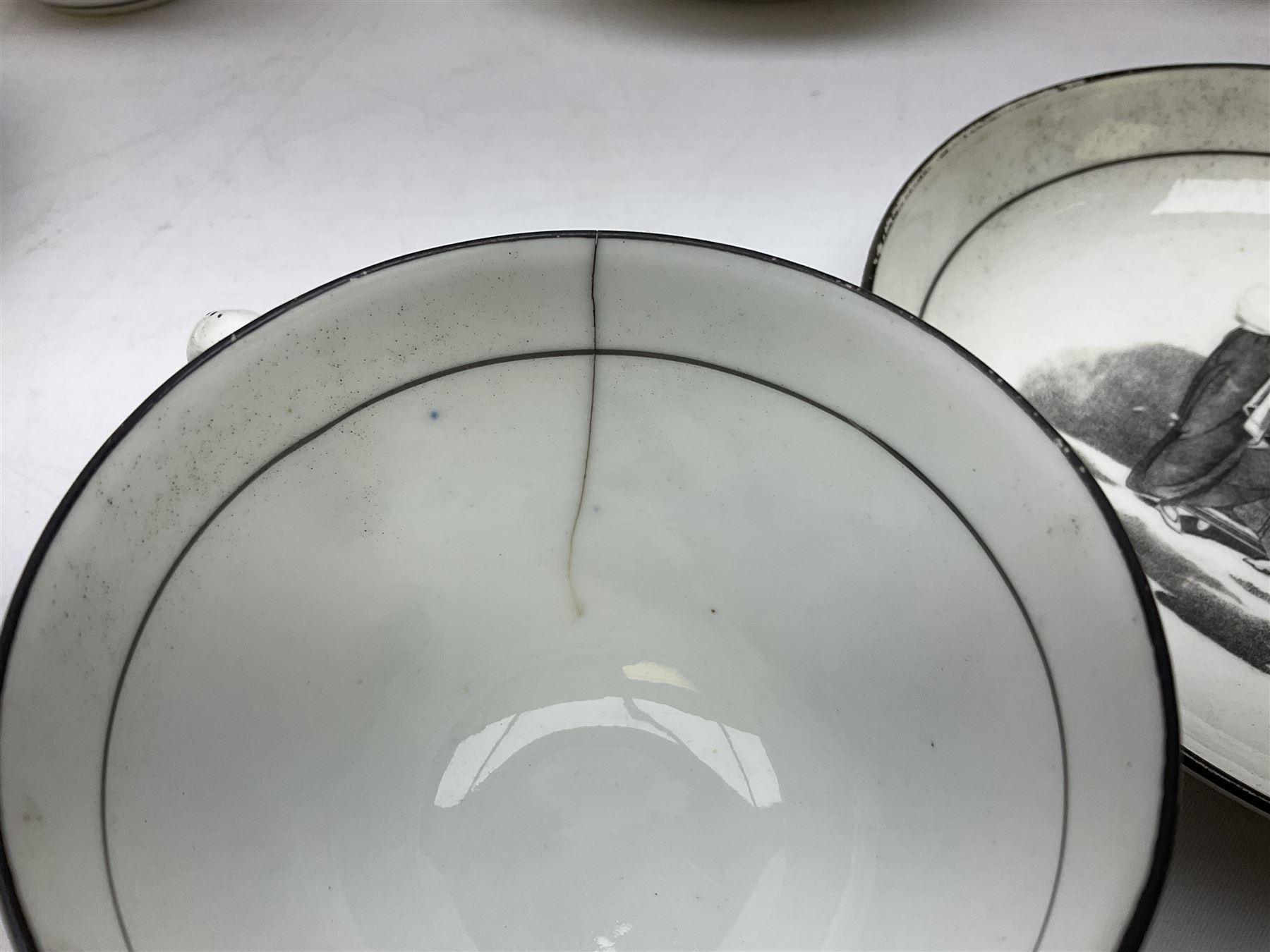 Early 19th century Staffordshire bat printed part tea service, decorated in black after Adam Buck with scenes of mother and child and other varying classical style scenes, within black bands, comprising teapot, slop bowl, jug, seven teacups and five saucers 