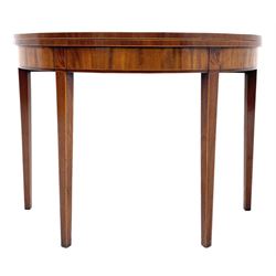 Early 19th century mahogany demi-lune tea table, fold over top with mahogany band and boxwood stringing, figured frieze, double gateleg action base, on square tapering supports