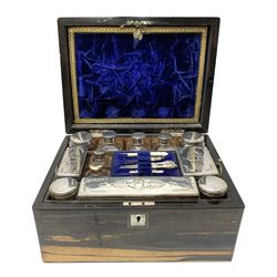 Victorian coromandel vanity box, of rectangular form with mother of pearl escutcheon and vacant plaque to the hinged cover, opening to reveal a compartmented and part plush lined interior, with hidden mirror and envelope compartment contained behind a crushed and gilt tooled partition, glass jars of various form, each with star cut base and a number with stoppers or silver plated covers, and mother of pearl handled manicure tools, H16cm L30cm D22.5cm