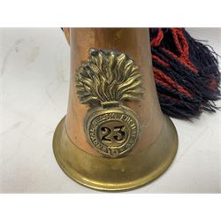 Reproduction copper and brass bugle applied with a badge for the 23rd Royal Welsh Fusiliers L32.5cm; and two re-enactment type cartridge belts (3)