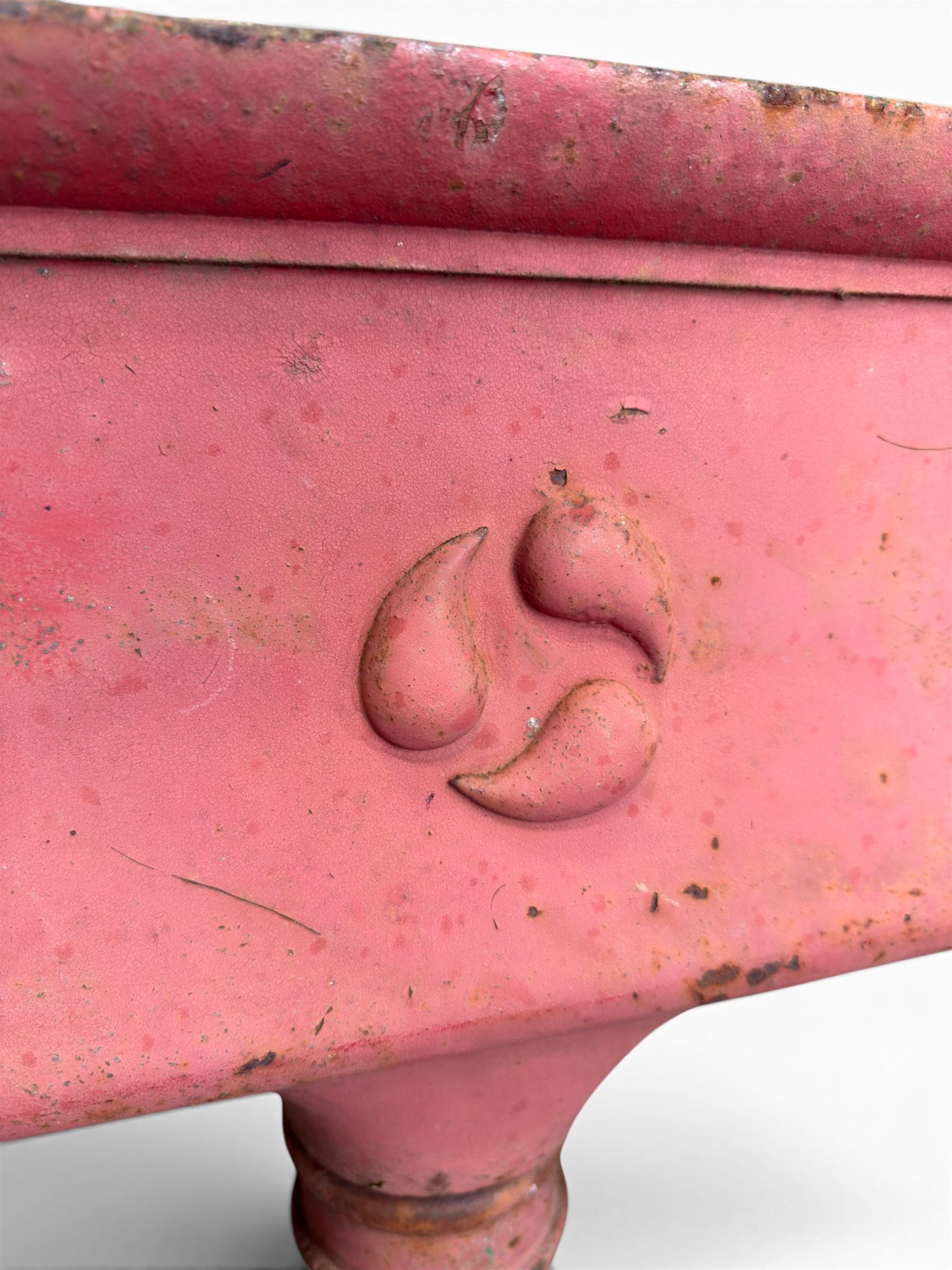Edwardian heavy cast iron rainwater hopper, with water motif, painted in pale red finish