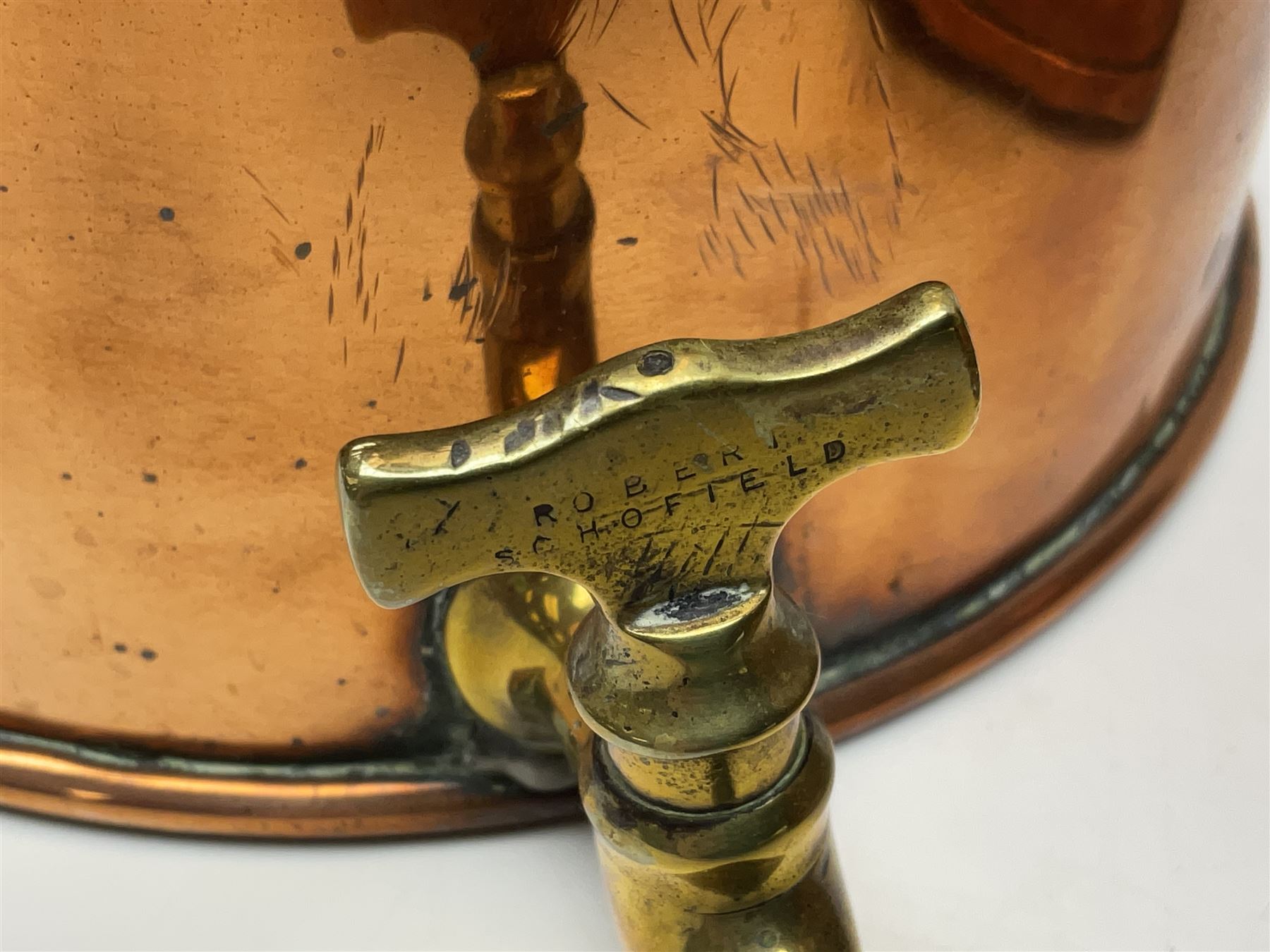 Victorian copper hot water urn, the body of plain cylindrical form with brass tap, the slightly domed lid with brass finial, together with a rectangular copper planter, with twin brass lion mask handles, urn H35cm
