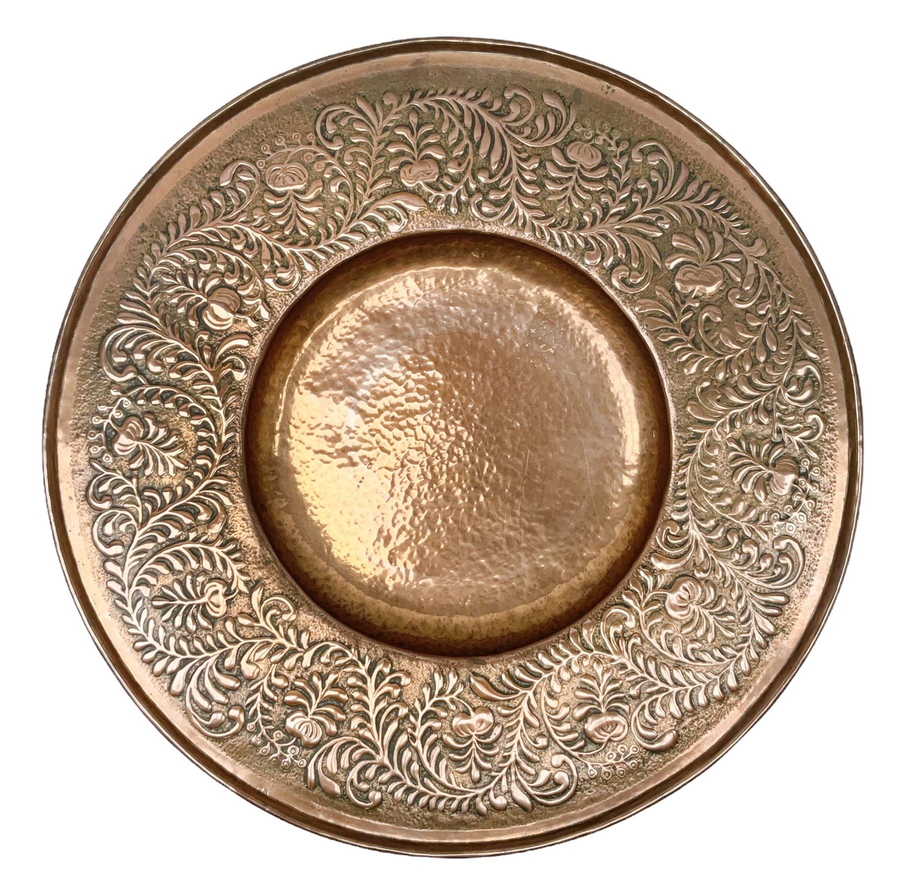 Arts and Crafts Keswick School of Industrial Arts copper charger, decorated with planished centre and repousse scrolling foliate tendrils to rim, D44cm