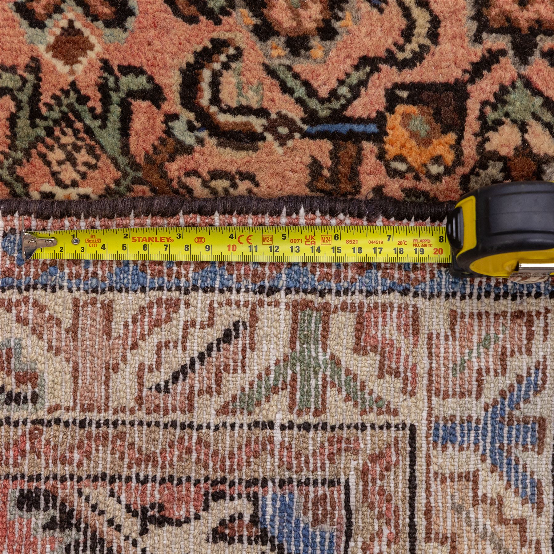 North West Persian Malayer hand-knotted runner, camel pink field decorated with an all-over lattice of Herati design, composed of rosettes and enclosed by angular leaves and stylized fish motifs, principal border of ivory ground decorated with stylized angular vine scroll and geometric palmettes, flanked by narrow guard stripes, with cotton fringe ends 