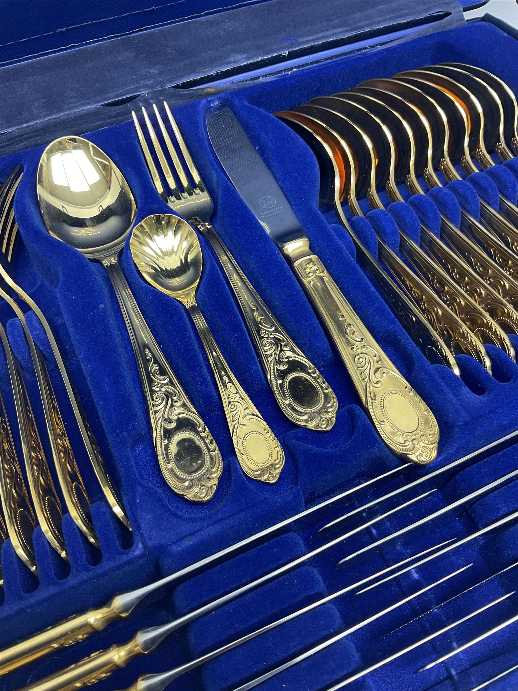 Bestecke Solingen canteen of gold plated cutlery for twelve place settings, including ladle, cake slice, fish servers, fish knives and forks, 108 pieces total, contained within a briefcase 