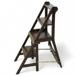 Arts & Crafts oak metamorphic chair, circular panelled back above hinged seat opening into a set of library steps with brass securing straps, circa 1900