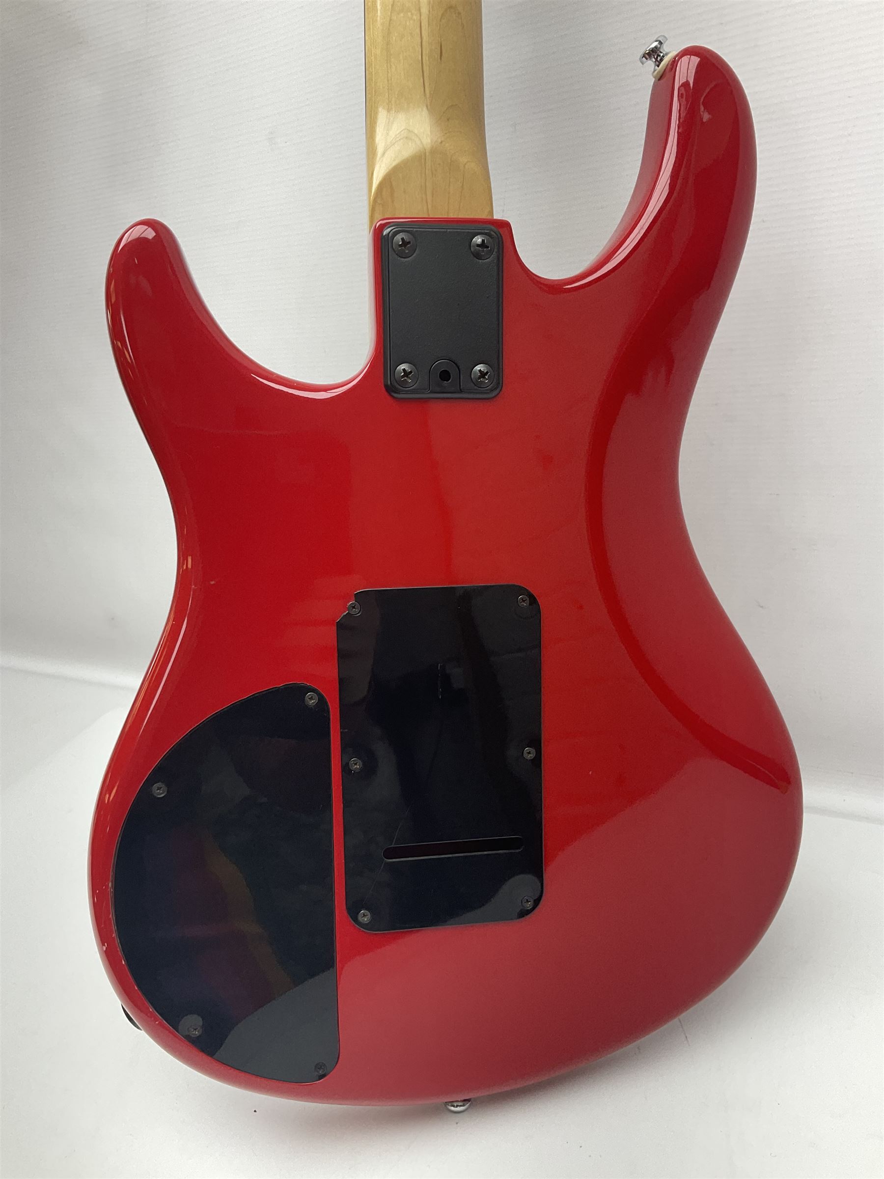 American Peavey Nitro 1 hand-made electric guitar in red with Kahler tremolo, serial no.02786479, L98cm overall; in soft carrying case.