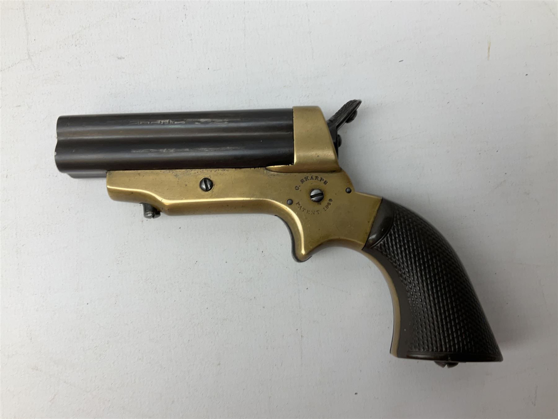 Mid-19th century Sharps' Patent Repeater four-barrelled Deringer pistol, dated 1859, approximately .30 calibre rim fire, brass bodied with rotating firing pin, serial no.8767, L16cm; in fitted rosewood box with label under lid, rack of ten deactivated cartridges, oil bottle and screwdriver and owner's name in brass cartouche to lid.