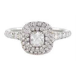 Tiffany & Co platinum diamond cluster ring, principle cushion cut diamond 0.23 carat, with round brilliant cut diamond halo surround and diamond set shoulders, stamped PT950, with certificate