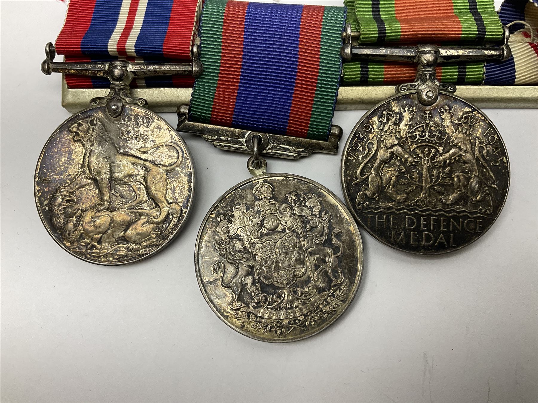 WW2 group of five medals comprising 1939-1945 War Medal, Defence Medal, 1939-1945 Star, France and Germany Star and Canadian Volunteer Service Medal; on wearing bar with ribbons; with a medal box and slip and three photographs