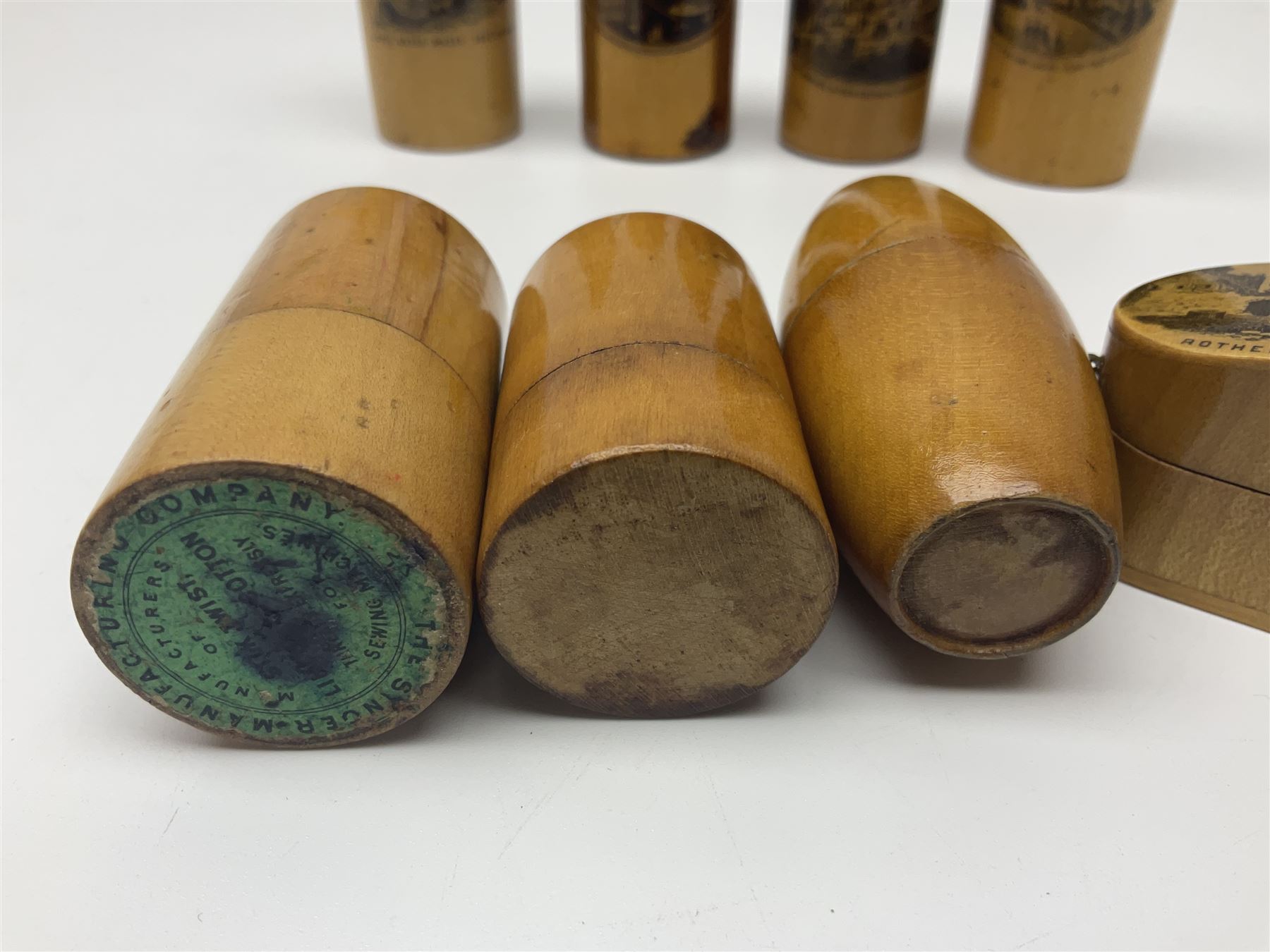 Collection of Mauchline ware relating to sewing, to include four ovoid shaped thimble cases, hinged lid thimble case and needle cases (12) 
