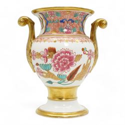 Early 19th century Spode vase and garniture, each decorated in the Japan pattern no. 868, with twin scroll handles and pedestal foot, H15.5cm max; together with Spode pen tray, pattern no. 093, L27cm; pastille burner, H8cm; and an 18th/19th century porcelain vase and cover, decorated with panels of flowers within orange and gilt bands, possibly Spode H16cm (6)